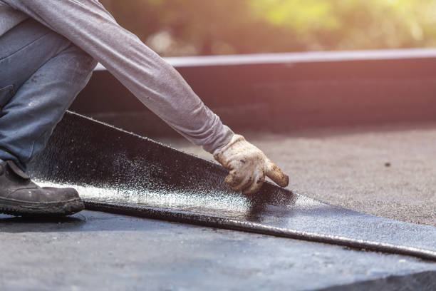 Professional Exterior Waterproofing technician working in Ludington, MI